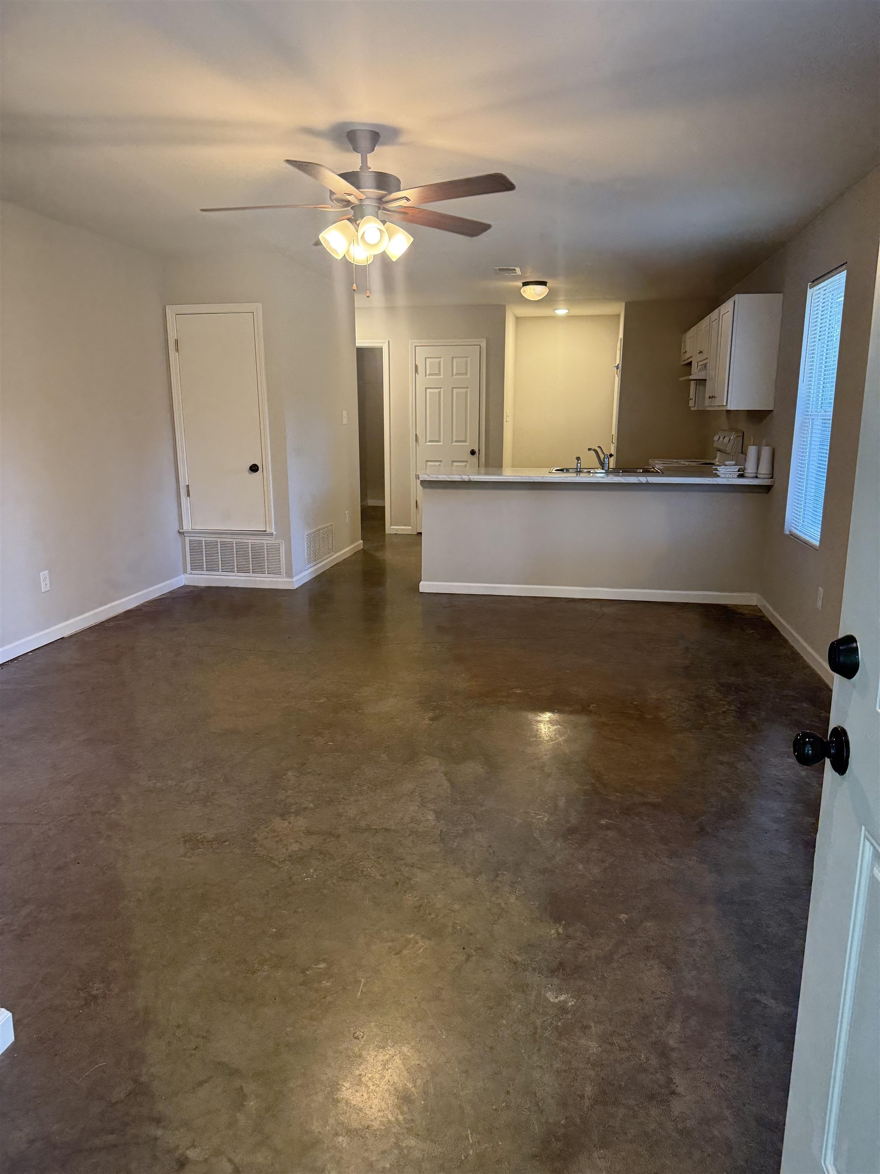 4589 Range Line Road Memphis, TN 38127 - Photo 3 of 25 a view of a kitchen with a sink and a large mirror or washer