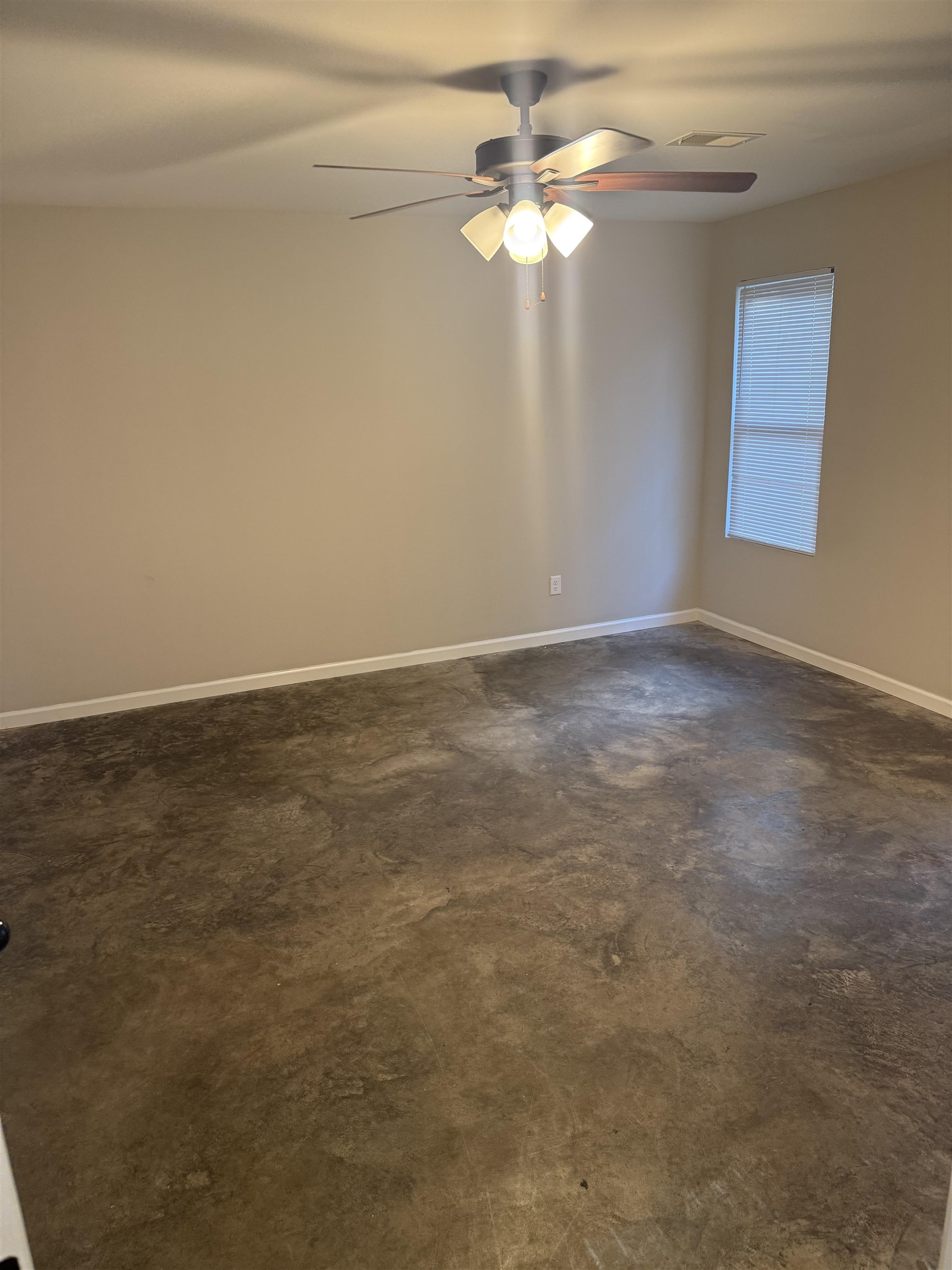 4589 Range Line Road Memphis, TN 38127 - Photo 7 of 25 a view of an empty room with chandelier fan