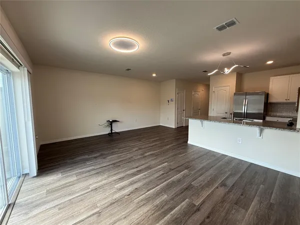 a view of kitchen and kitchen with a decorative lights