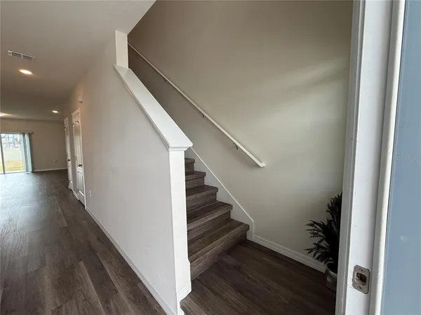 a view of entryway with wooden floor