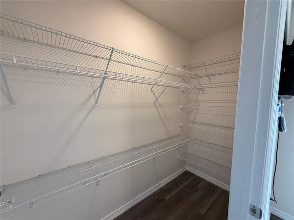 a view of a room with racks on the wall