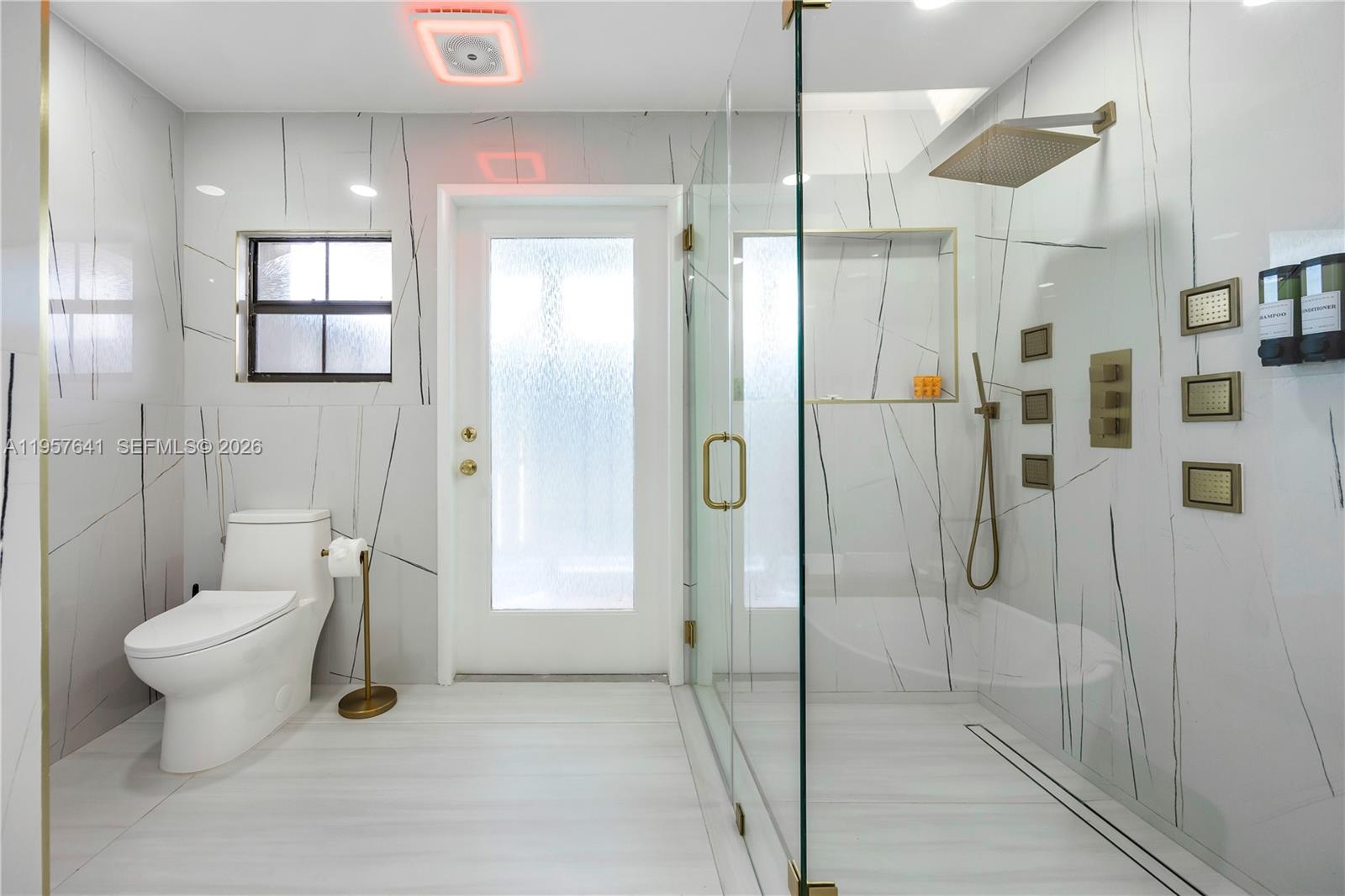 2532 Southeast 13th Street Pompano Beach, FL 33062 - Photo 14 of 69 a bathroom with a toilet and a shower