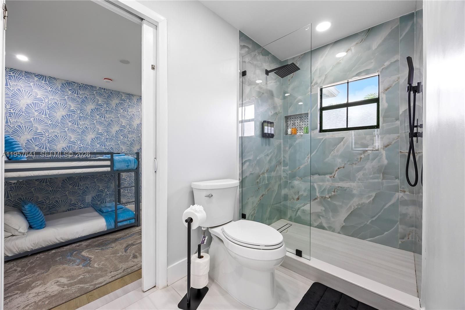 2532 Southeast 13th Street Pompano Beach, FL 33062 - Photo 41 of 69 a bathroom with a toilet and a shower