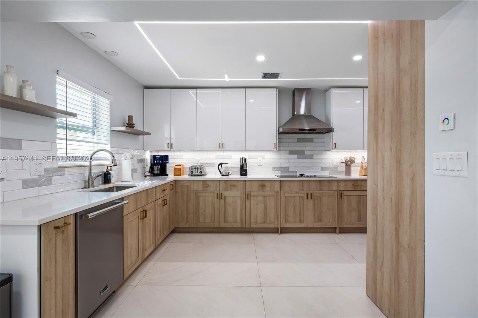 2532 Southeast 13th Street Pompano Beach, FL 33062 - Photo 5 of 69 a kitchen with stainless steel appliances granite countertop a sink and cabinets