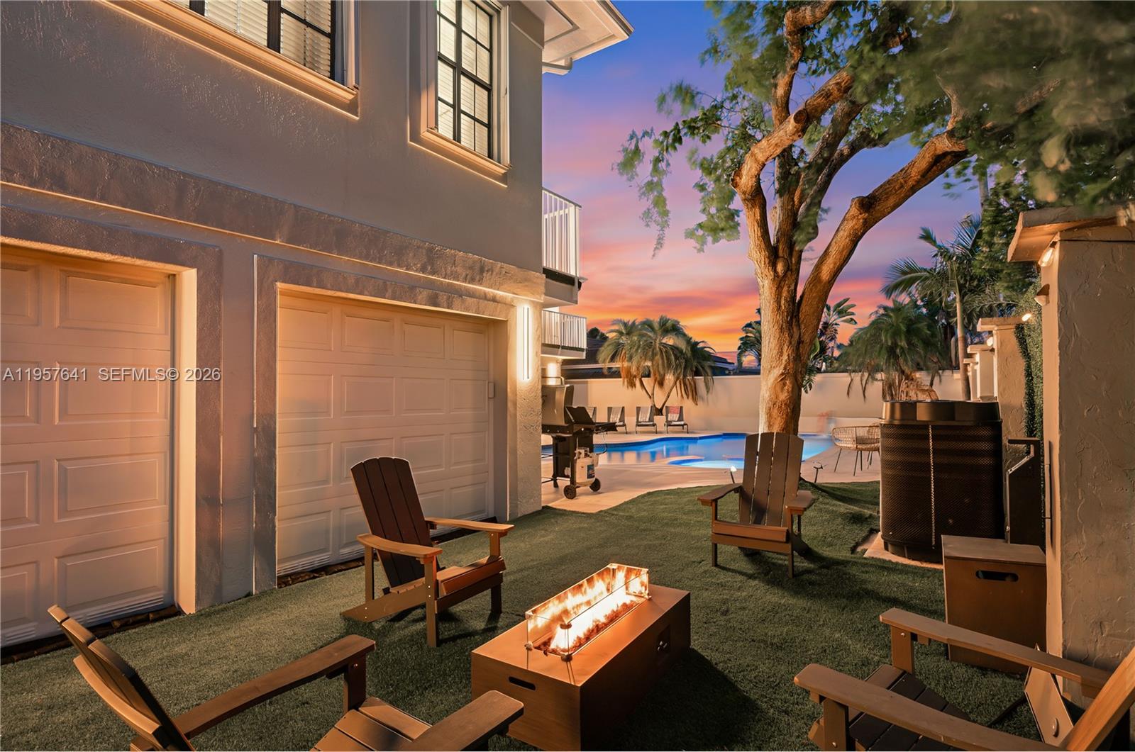 2532 Southeast 13th Street Pompano Beach, FL 33062 - Photo 53 of 69 a backyard of a house with barbeque oven table and chairs