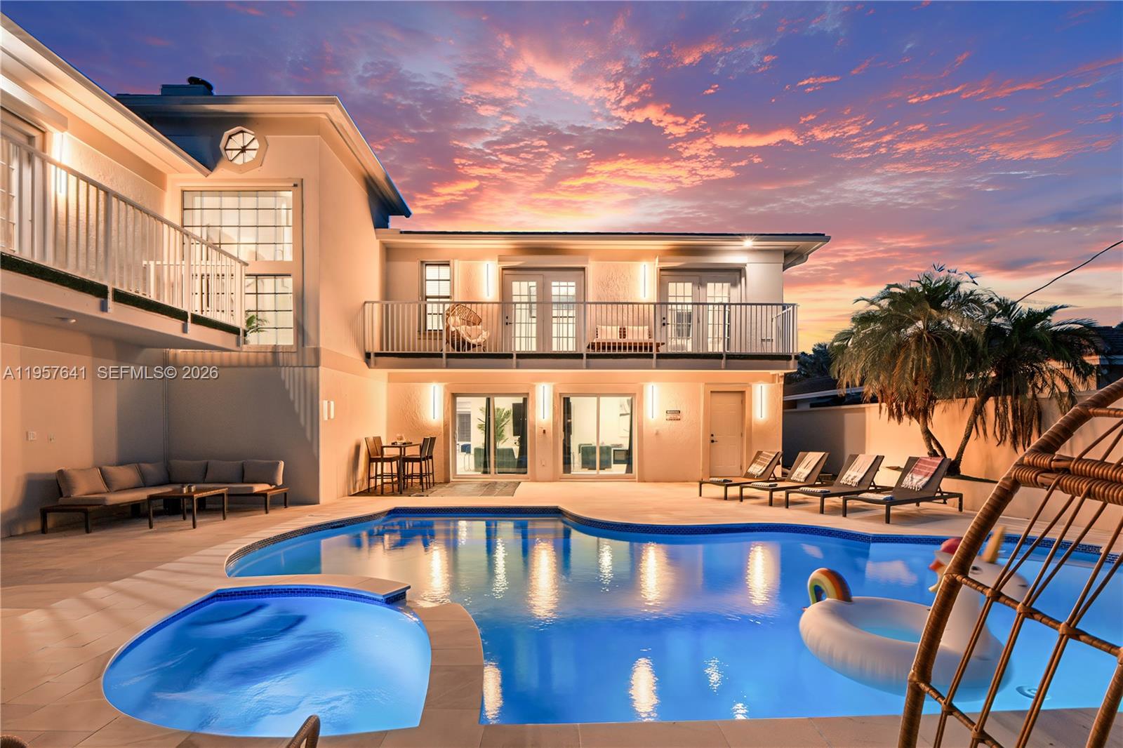 2532 Southeast 13th Street Pompano Beach, FL 33062 - Photo 54 of 69 a view of a swimming pool with an outdoor seating