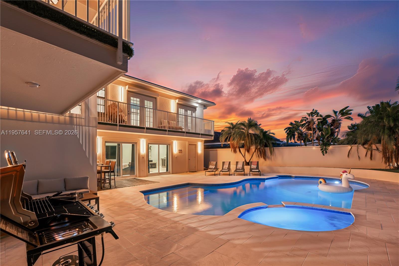 2532 Southeast 13th Street Pompano Beach, FL 33062 - Photo 58 of 69 a view of a swimming pool with an outdoor seating