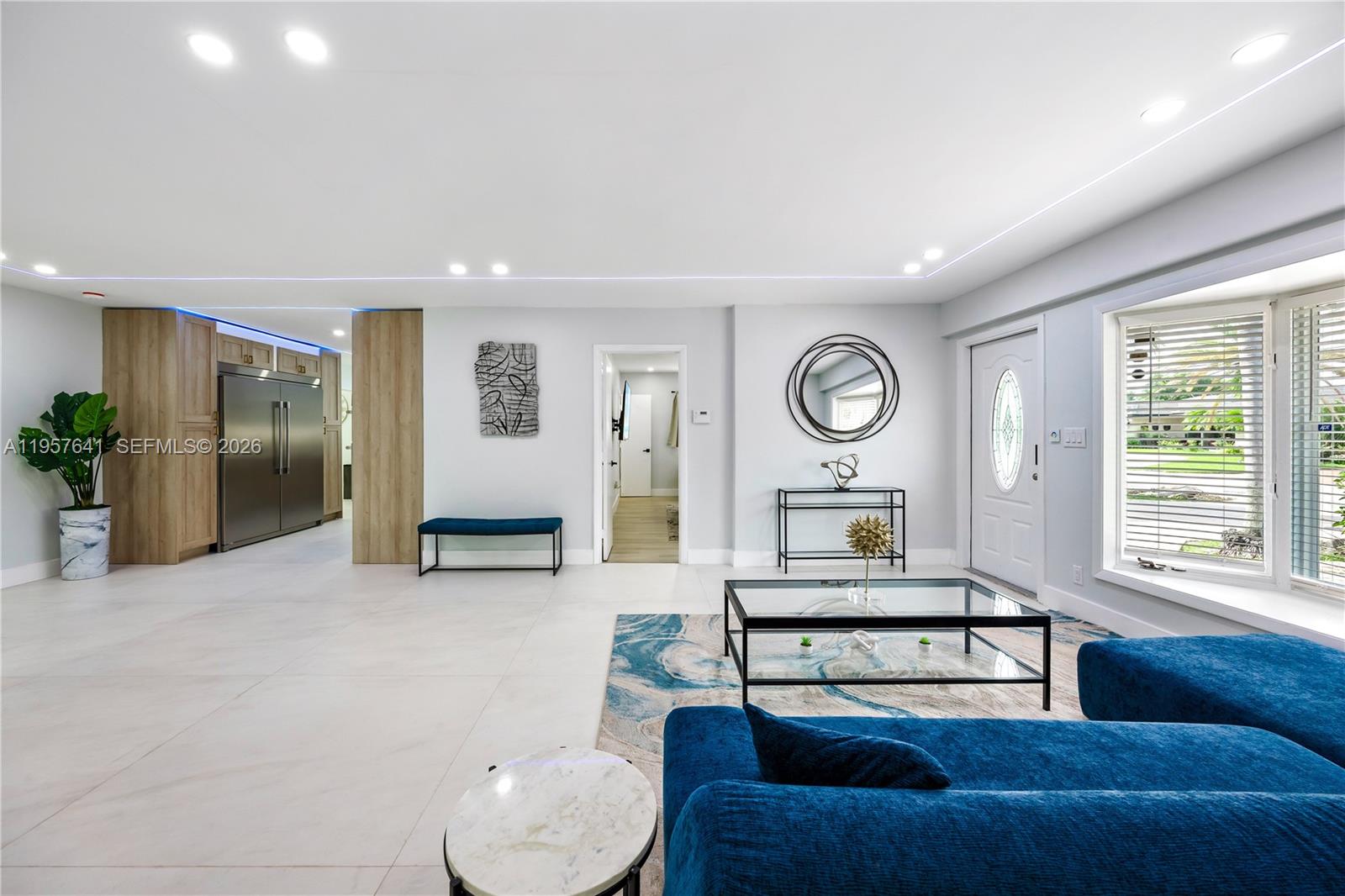 2532 Southeast 13th Street Pompano Beach, FL 33062 - Photo 59 of 69 a living room with furniture and a large window