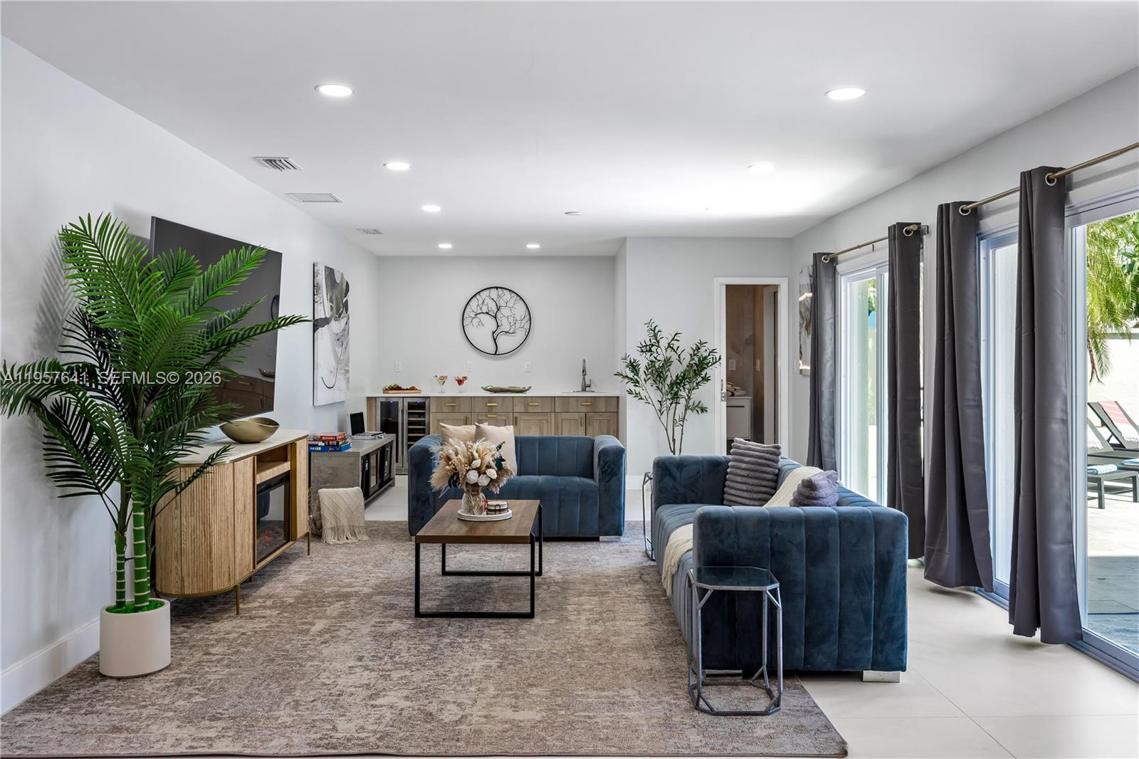 2532 Southeast 13th Street Pompano Beach, FL 33062 - Photo 60 of 69 a living room with furniture and a potted plant