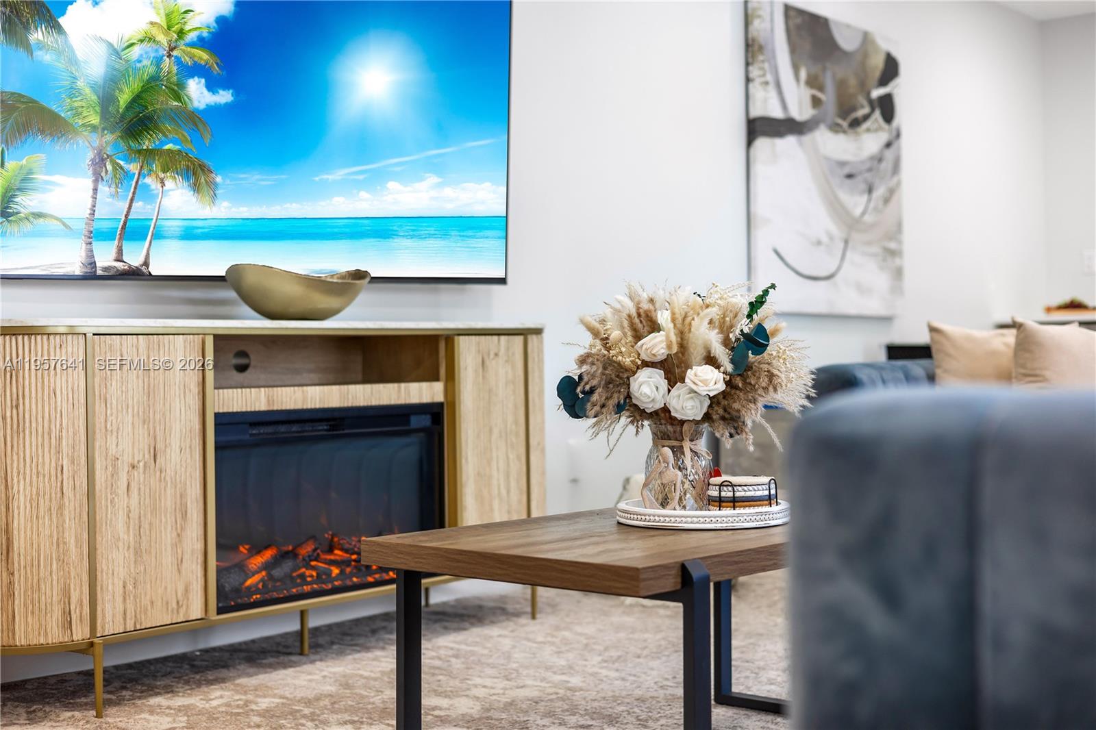 2532 Southeast 13th Street Pompano Beach, FL 33062 - Photo 62 of 69 a living room with furniture and a potted plant