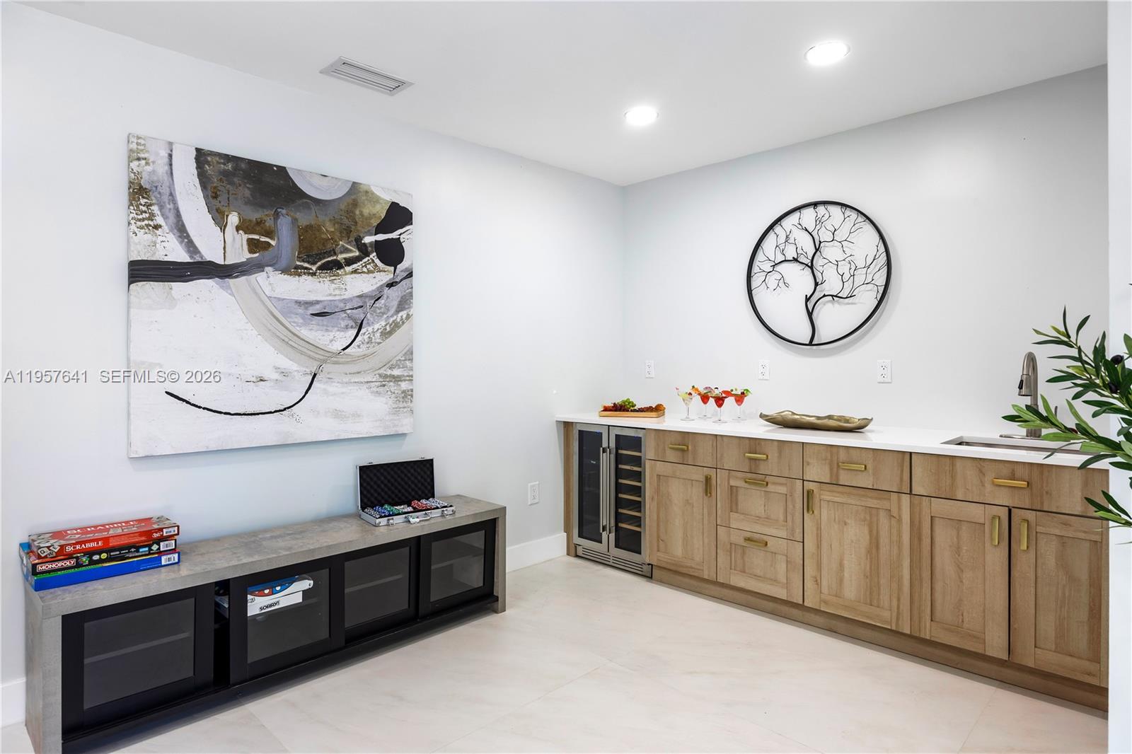 2532 Southeast 13th Street Pompano Beach, FL 33062 - Photo 63 of 69 a living room with stainless steel appliances kitchen island a stove and a wooden floors