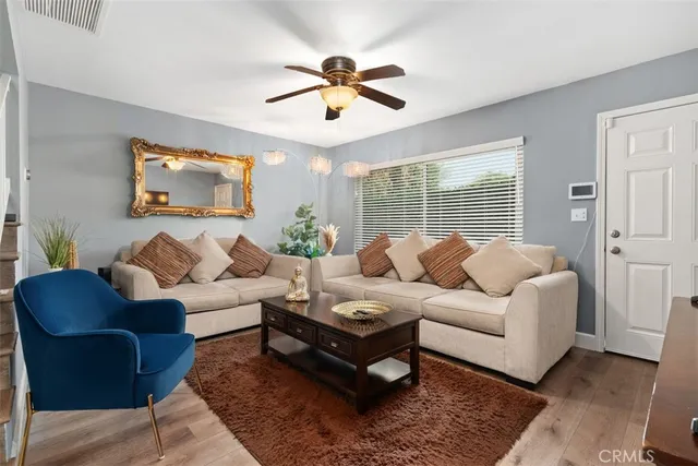 a living room with furniture rug and window
