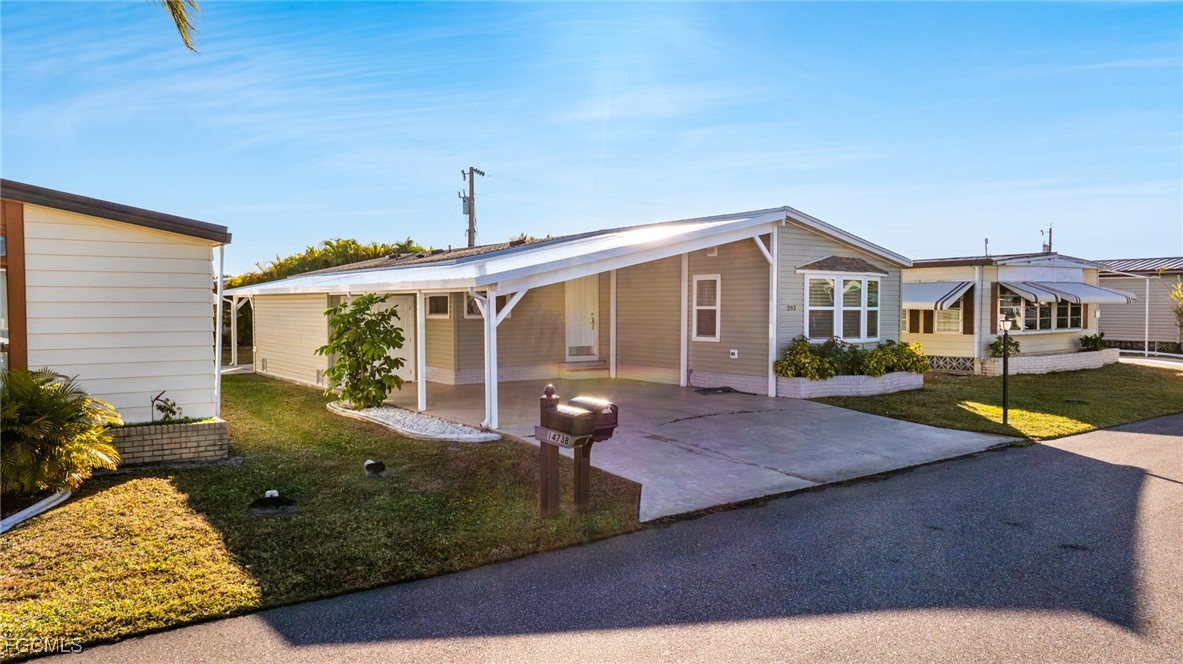 14736 Patrick Henry Road North Fort Myers, FL 33917 - Photo 1 of 47 a view of a house with swimming pool and sitting area
