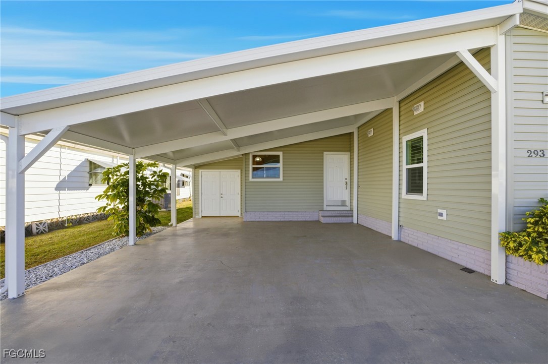 14736 Patrick Henry Road North Fort Myers, FL 33917 - Photo 2 of 47 a view of a house with an empty space and balcony