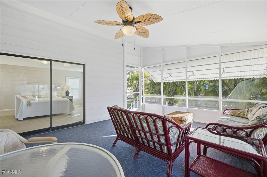 14736 Patrick Henry Road North Fort Myers, FL 33917 - Photo 29 of 47 a living room with furniture and a large window