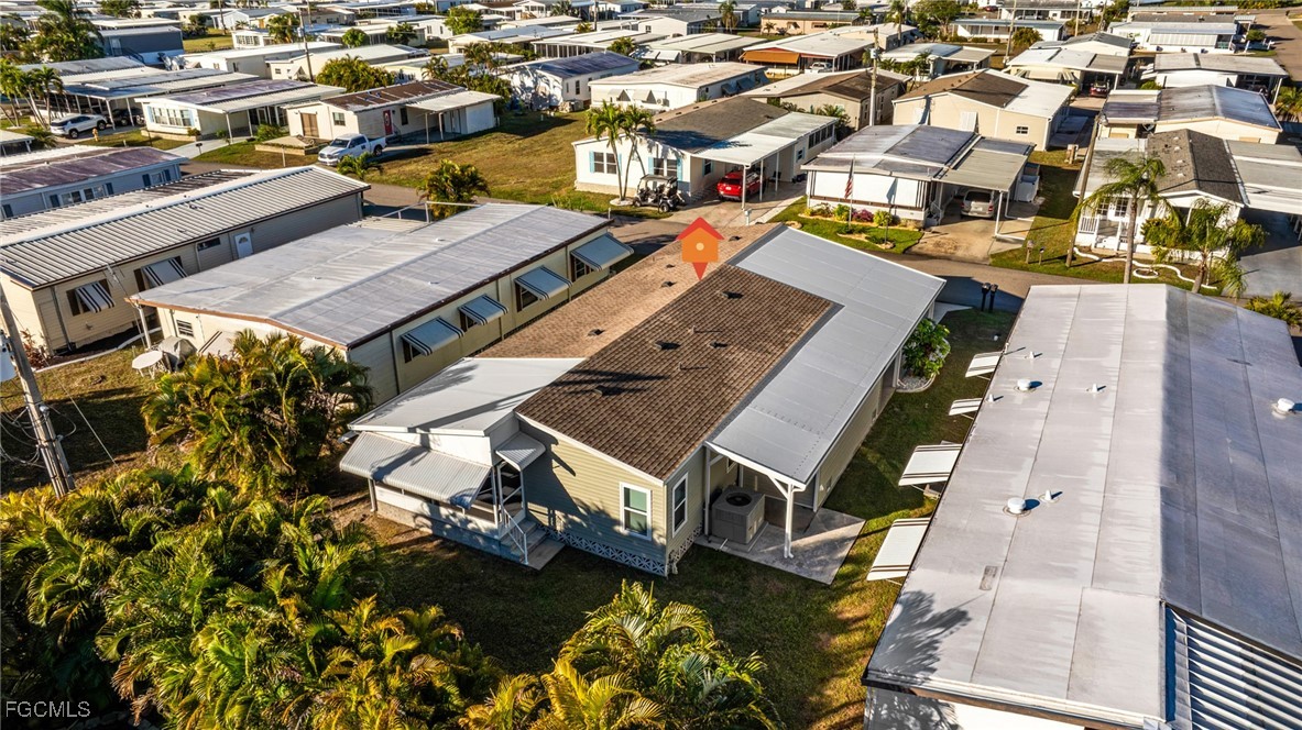 14736 Patrick Henry Road North Fort Myers, FL 33917 - Photo 31 of 47 an aerial view of a residential apartment building with a yard