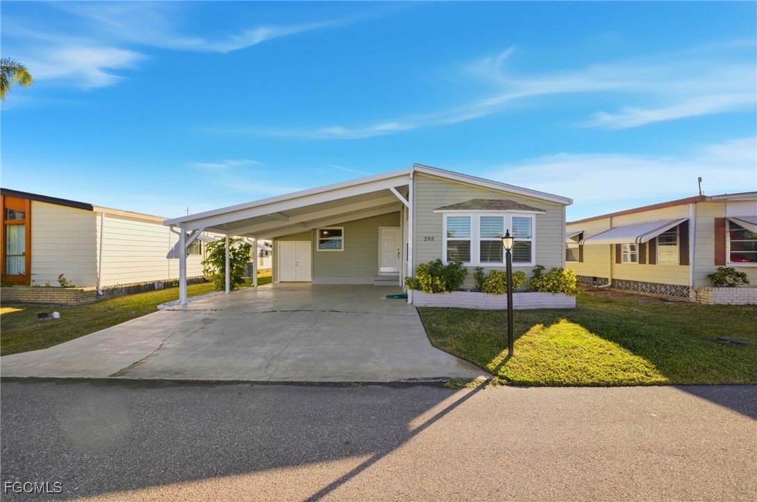 14736 Patrick Henry Road North Fort Myers, FL 33917 - Photo 33 of 47 a front view of a house with yard and green space