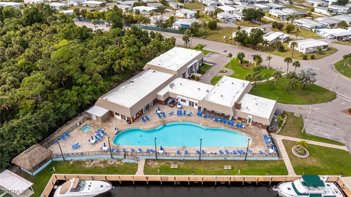 14736 Patrick Henry Road North Fort Myers, FL 33917 - Photo 38 of 47 an aerial view of a building with garden space and outdoor seating
