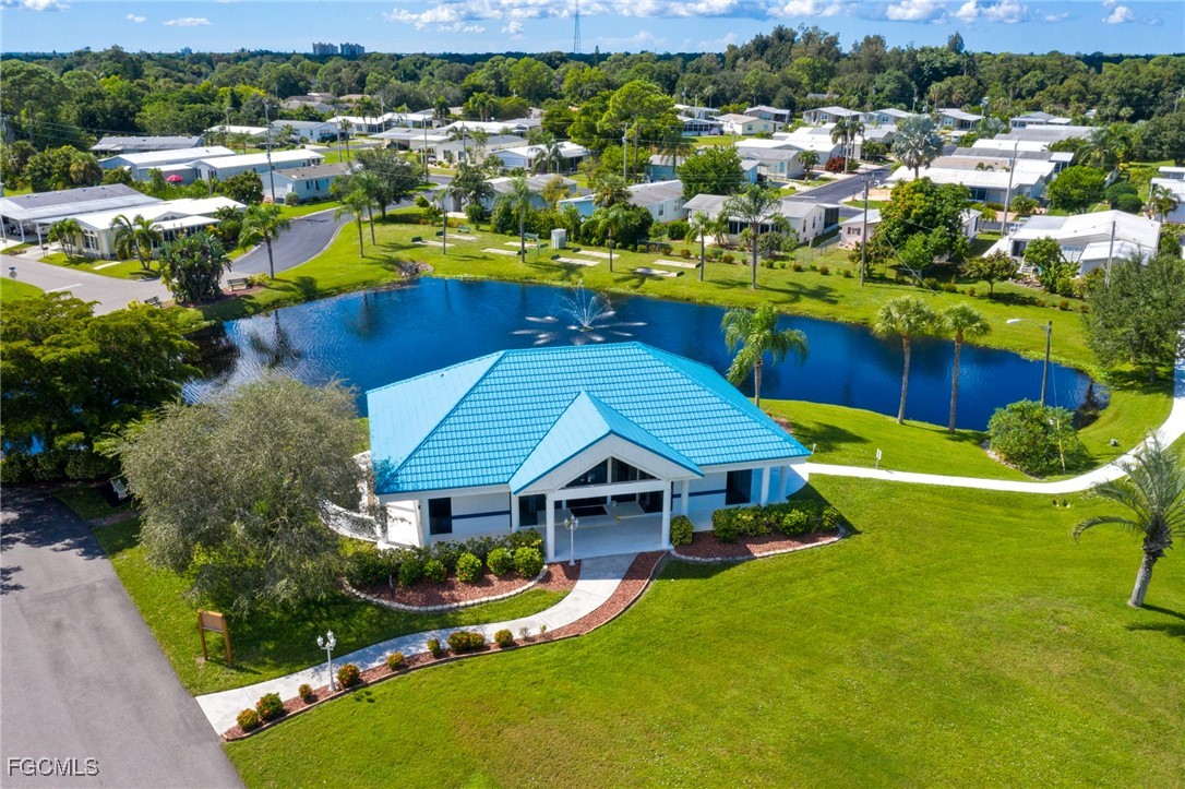 14736 Patrick Henry Road North Fort Myers, FL 33917 - Photo 42 of 47 a view of a house with a big yard and large trees