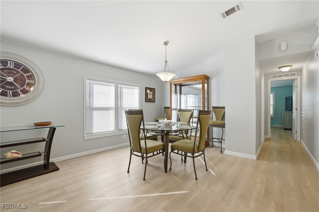 14736 Patrick Henry Road North Fort Myers, FL 33917 - Photo 6 of 47 a view of a dining room with furniture and window