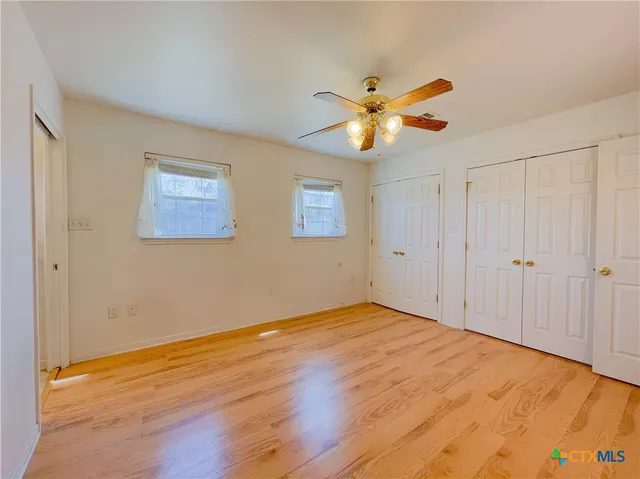 a bathroom with a sink a toilet and vanity