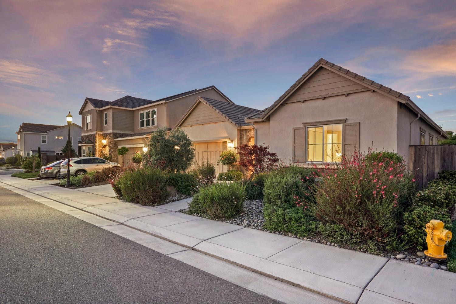 2931 Concerto Court Lodi, CA 95242 - Photo 2 of 54 a front view of a house with a yard and garage