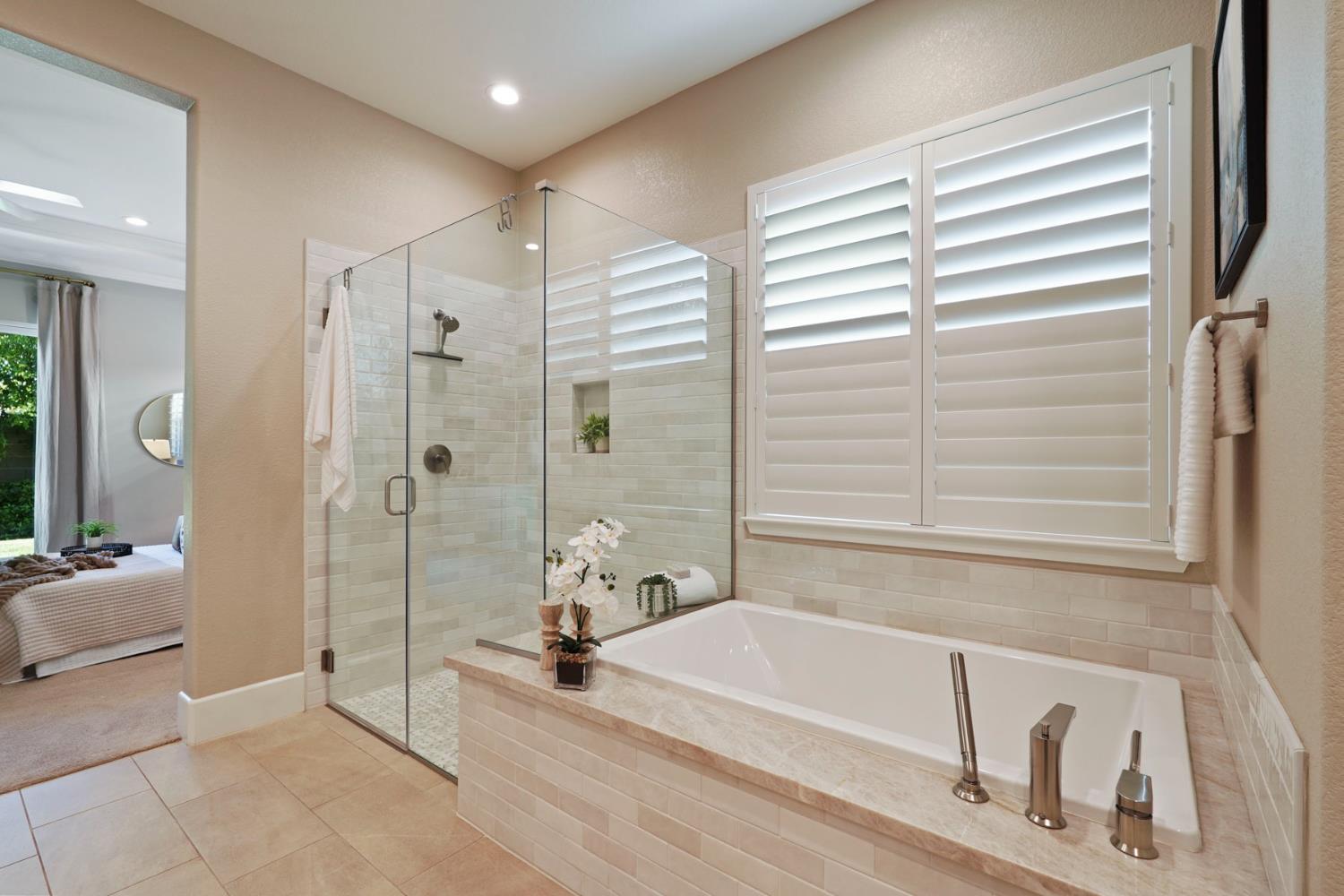 2931 Concerto Court Lodi, CA 95242 - Photo 39 of 54 a bathroom with a tub a window and a shower
