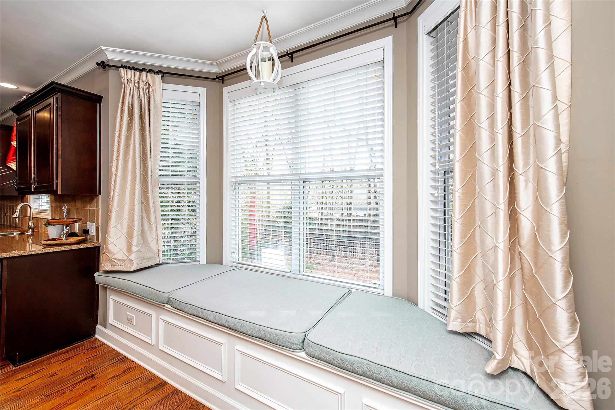 18432 East Marbella Lane Fort Mill, SC 29707 - Photo 13 of 47 a living room with stainless steel appliances granite countertop furniture and a flat screen tv