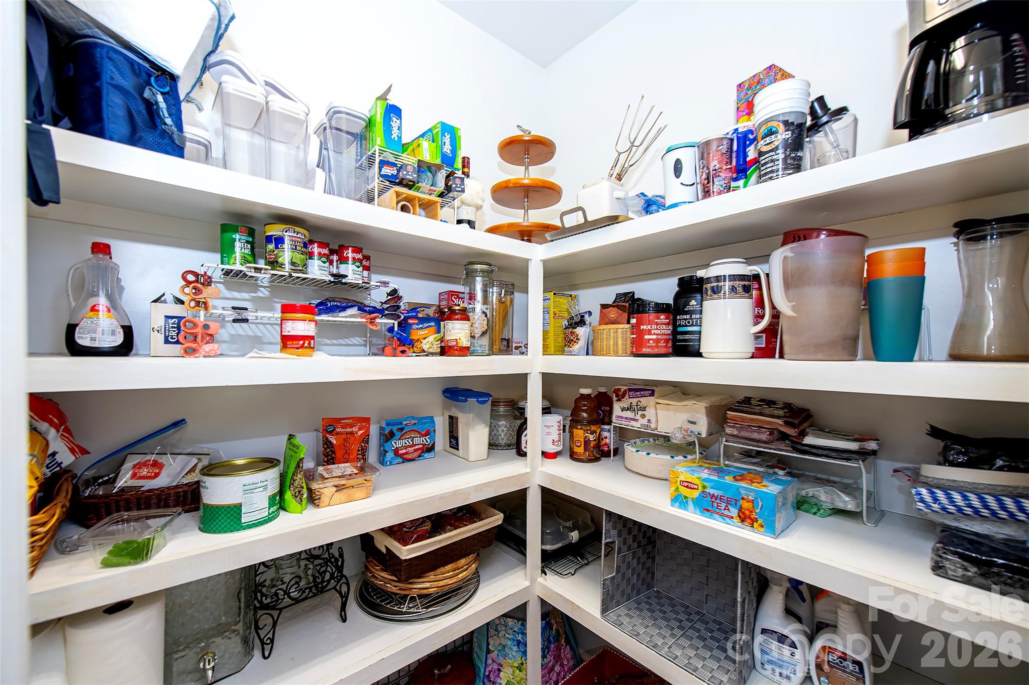 18432 East Marbella Lane Fort Mill, SC 29707 - Photo 44 of 47 a utility room with stainless steel appliances lots of clutter and refrigerator