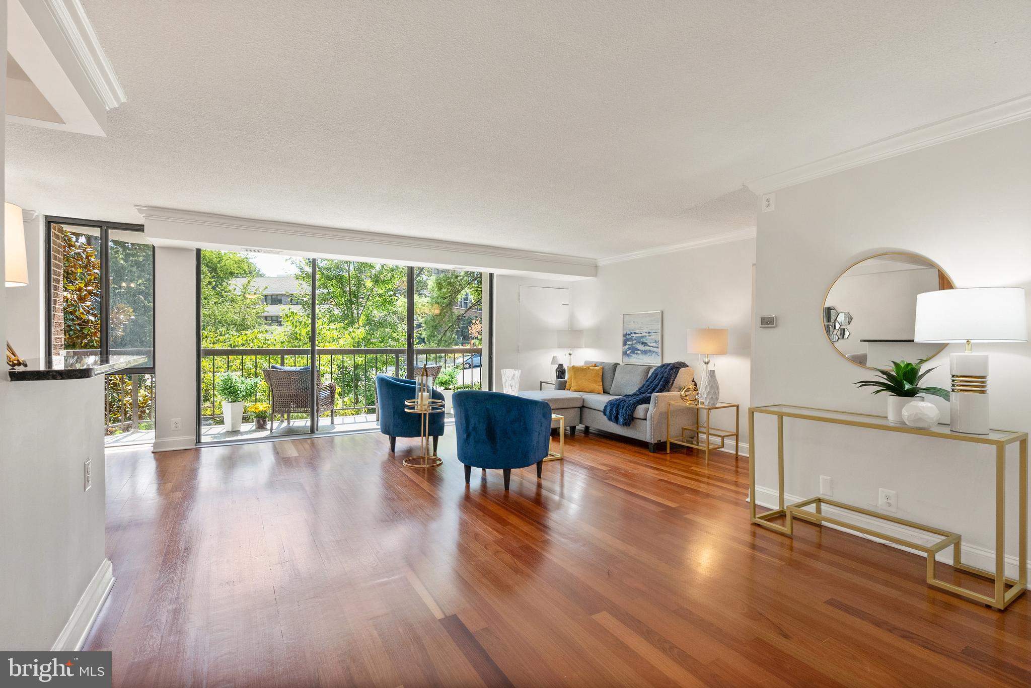 1401 North Rhodes Street, Unit 102 Arlington, VA 22209 - Photo 1 of 21 a living room with furniture and a large window