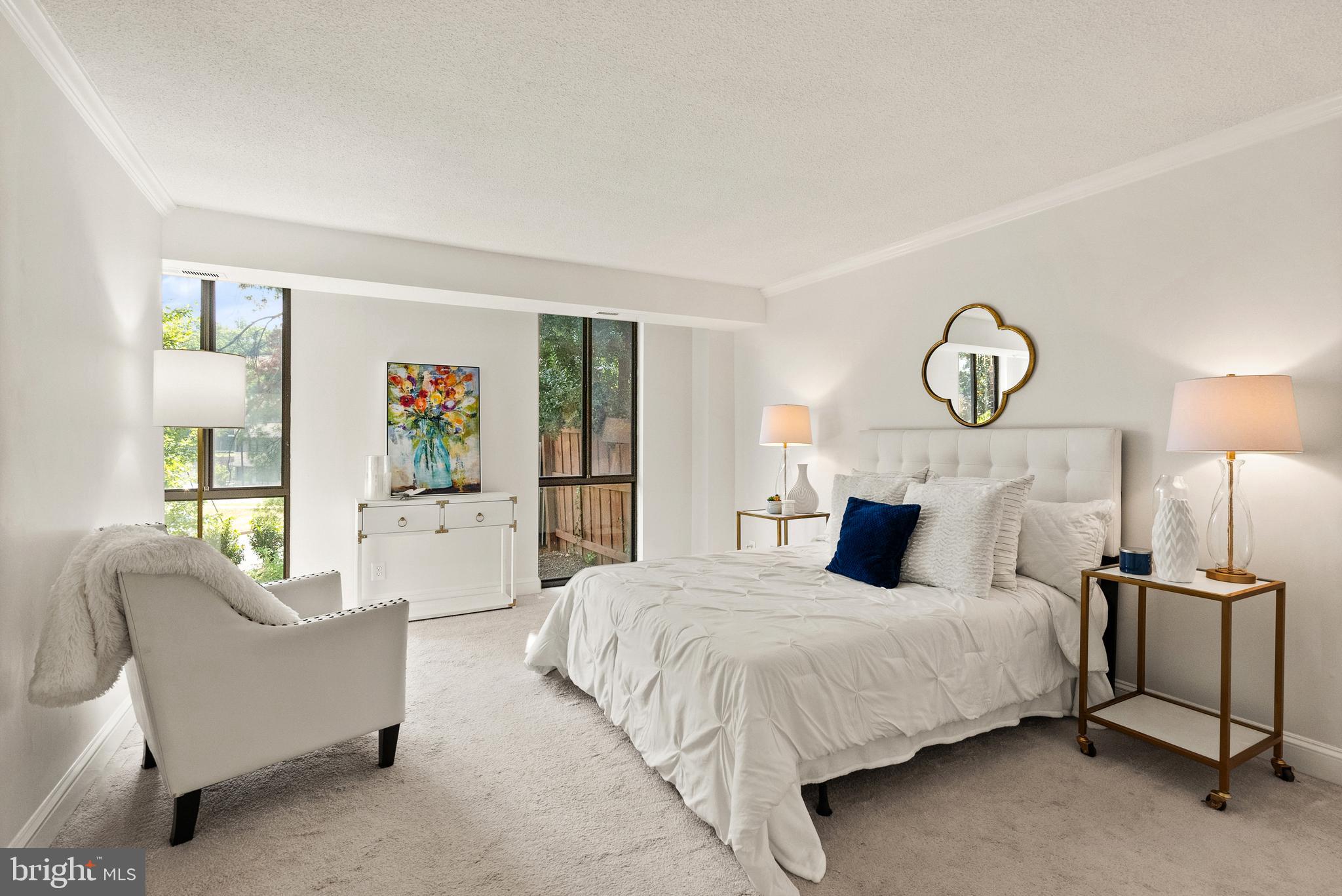 1401 North Rhodes Street, Unit 102 Arlington, VA 22209 - Photo 11 of 21 a bedroom with bed and a large window
