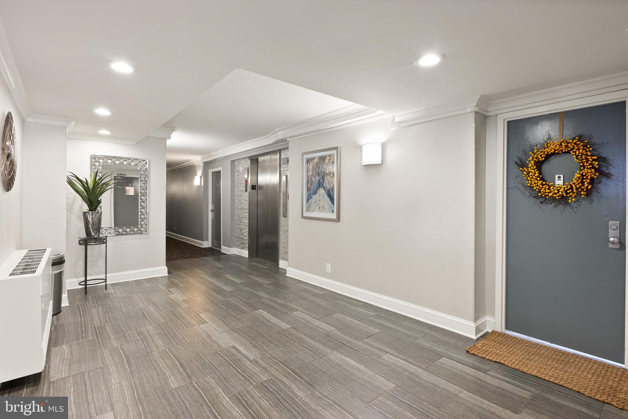 1401 North Rhodes Street, Unit 102 Arlington, VA 22209 - Photo 18 of 21 a view of livingroom with hardwood floor and hallway