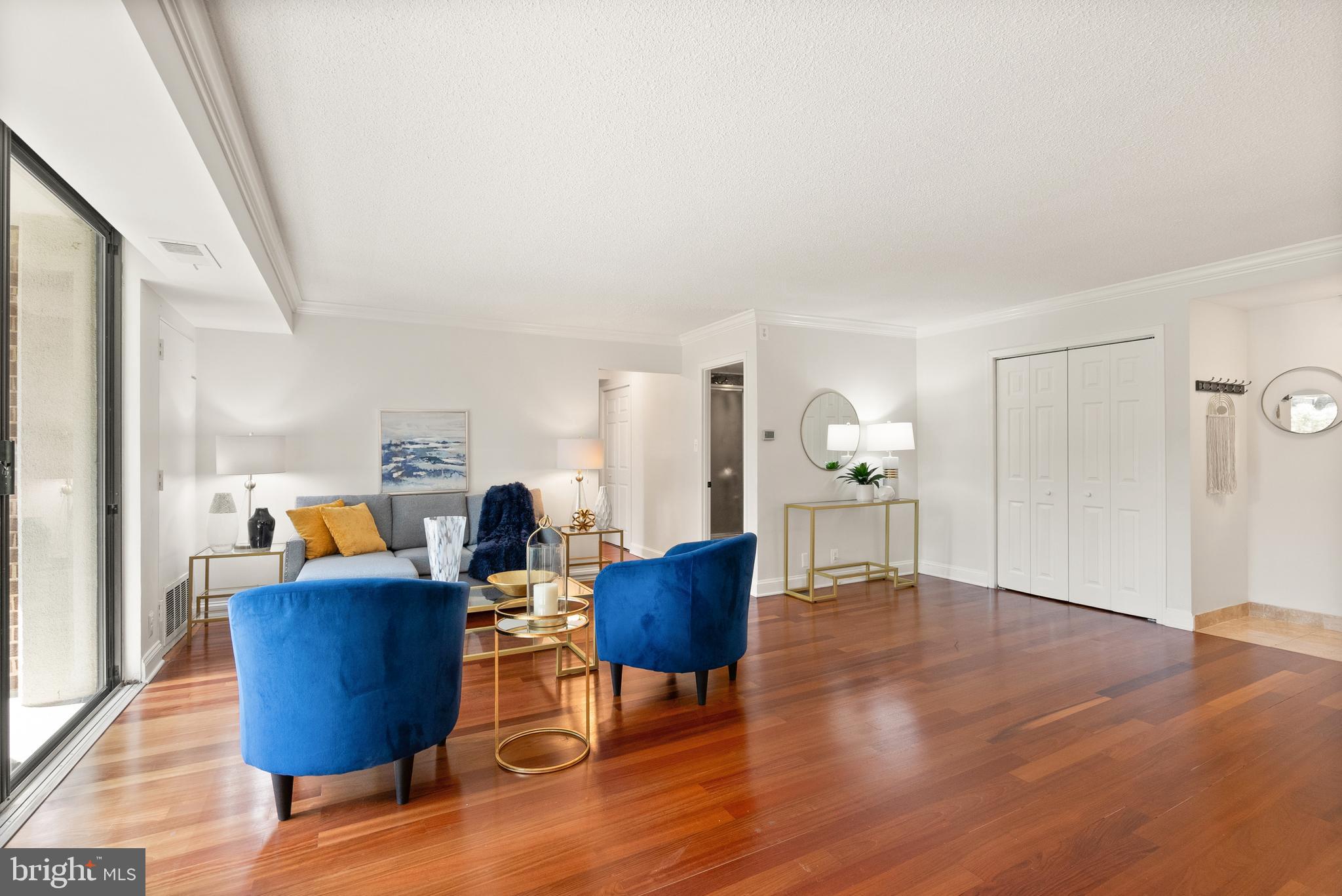 1401 North Rhodes Street, Unit 102 Arlington, VA 22209 - Photo 9 of 21 a living room with furniture and wooden floor