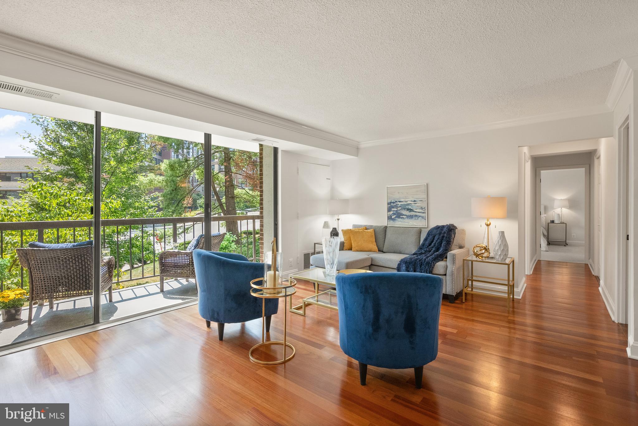 1401 North Rhodes Street, Unit 102 Arlington, VA 22209 - Photo 10 of 21 a living room with furniture and large windows
