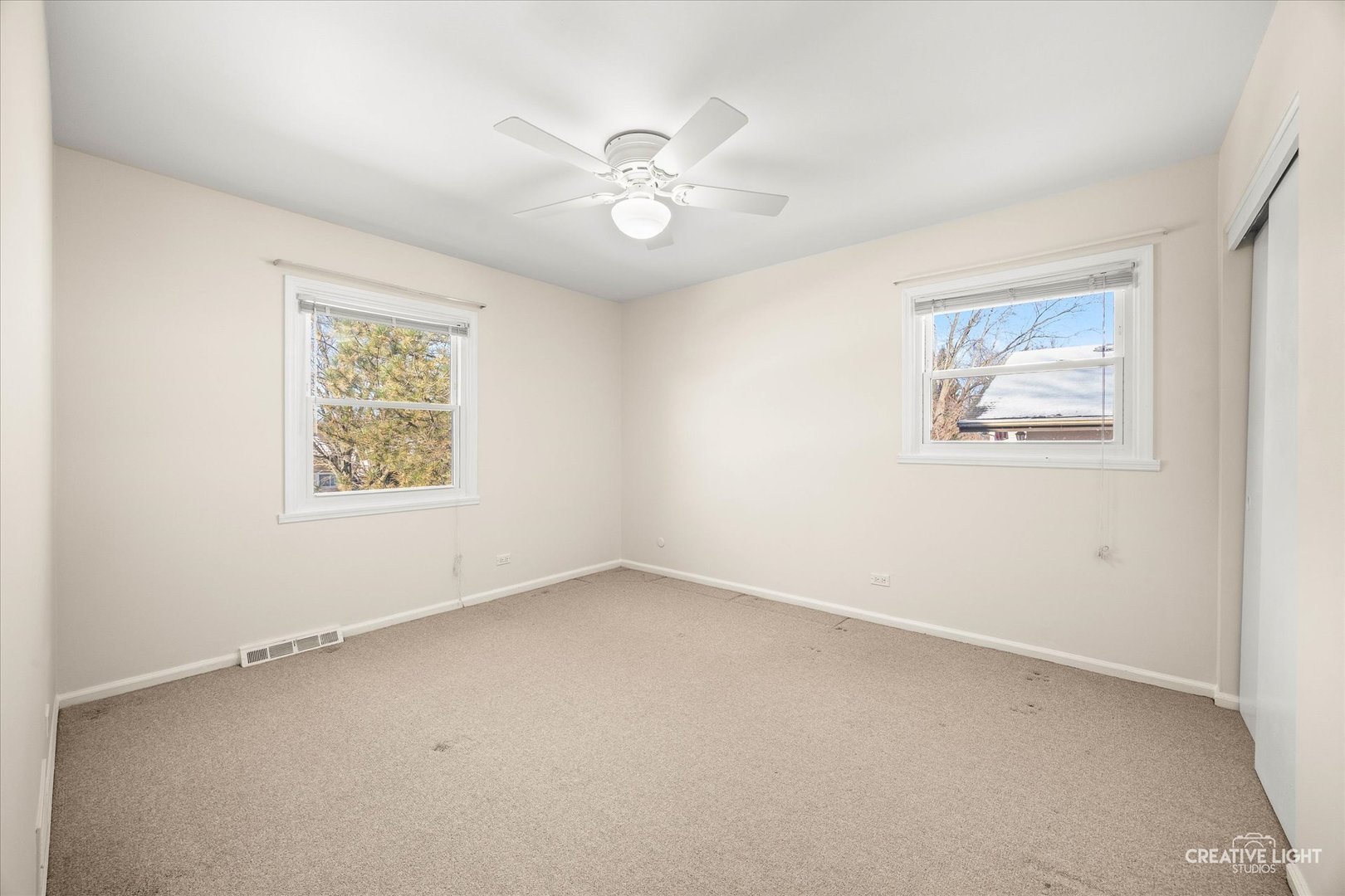 N071 Stanley Street Wheaton, IL 60187 - Photo 14 of 29 an empty room with a window and a fan