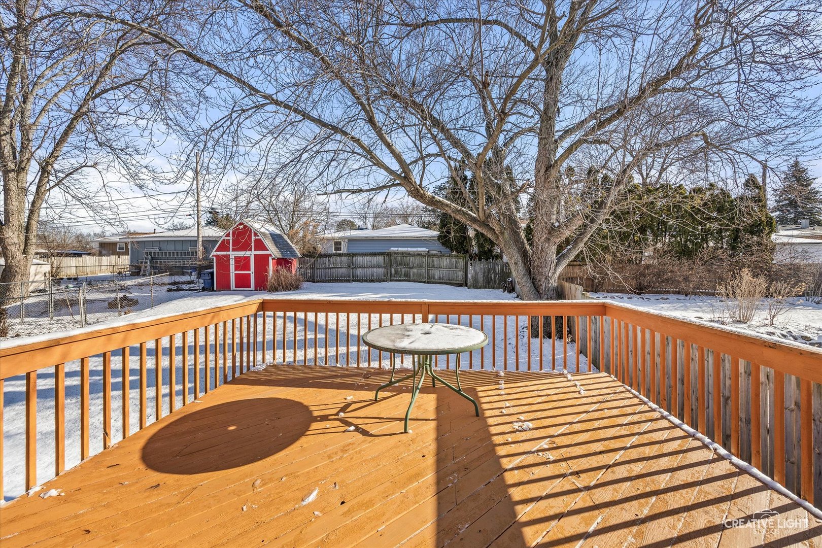 N071 Stanley Street Wheaton, IL 60187 - Photo 23 of 29 a view of deck with large trees and wooden fence