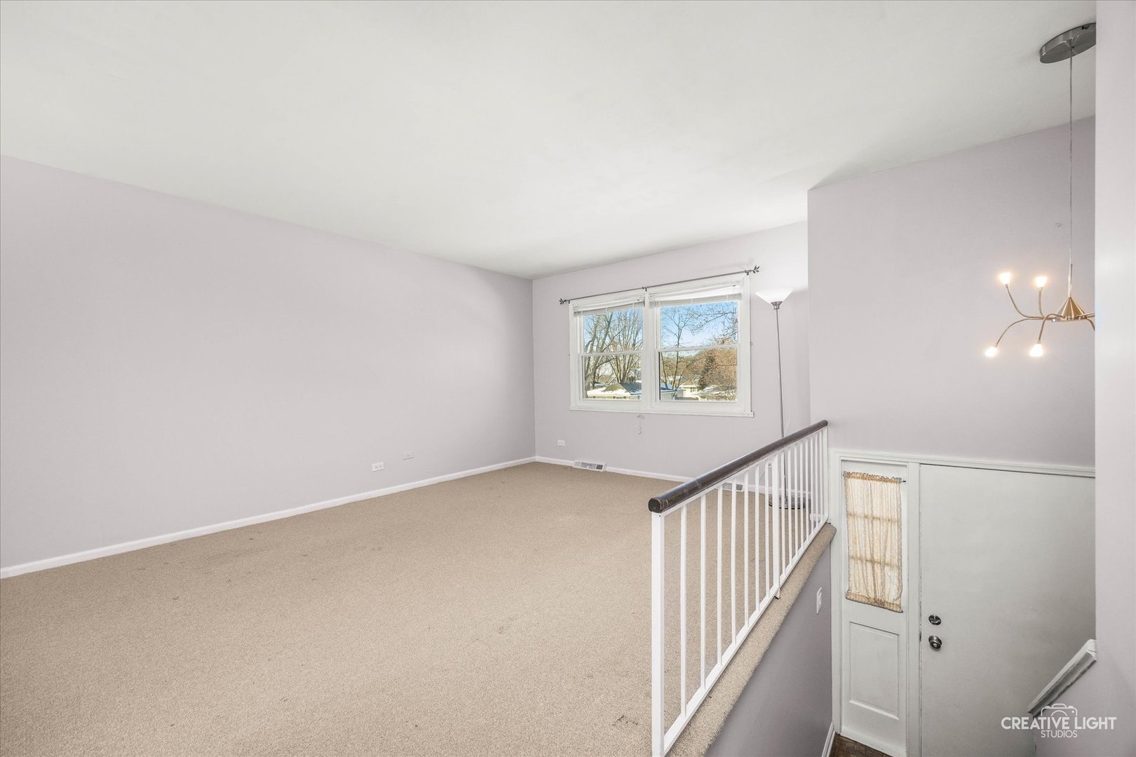 N071 Stanley Street Wheaton, IL 60187 - Photo 3 of 29 wooden floor in an empty room with a window