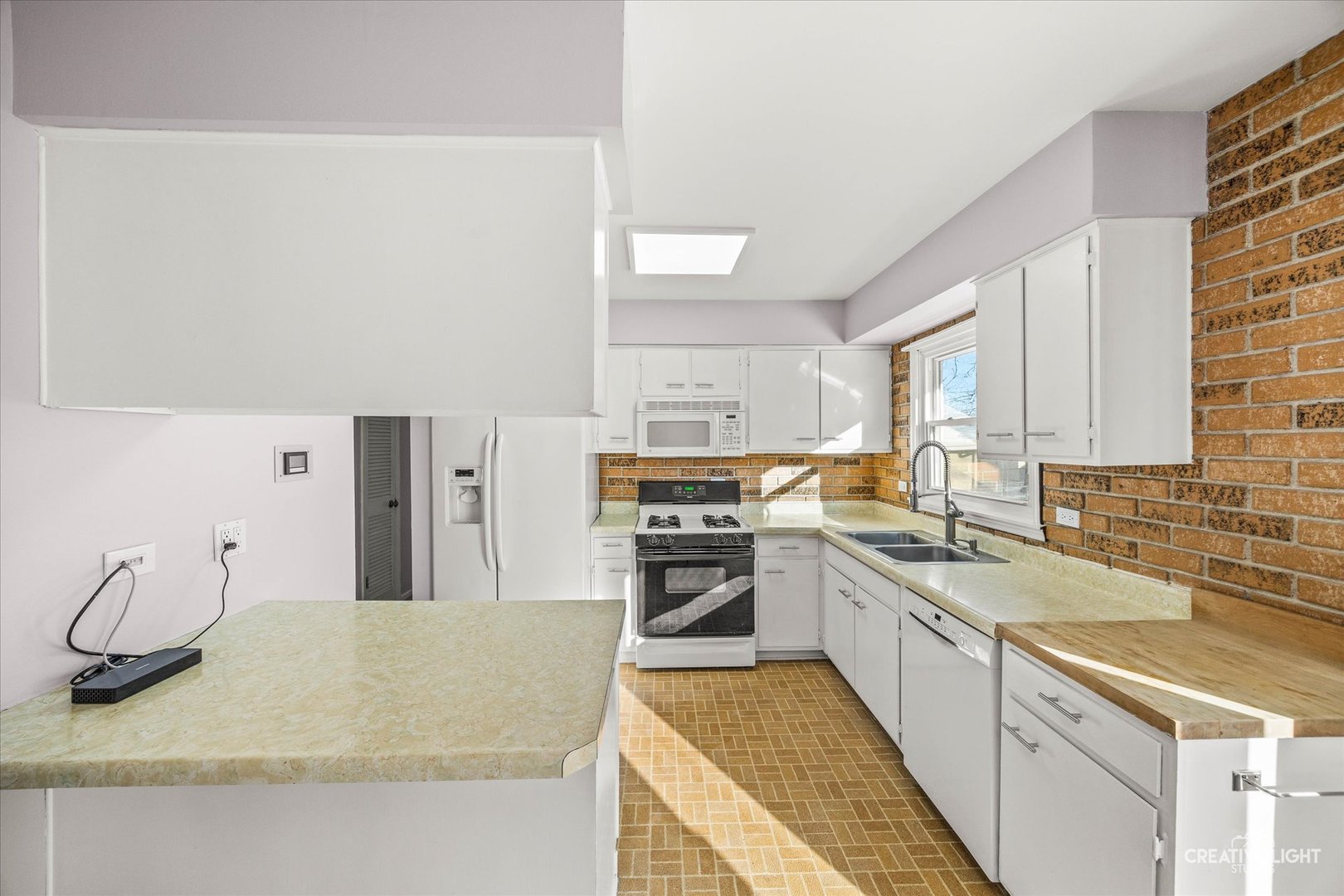 N071 Stanley Street Wheaton, IL 60187 - Photo 8 of 29 a kitchen with a sink stove and cabinets