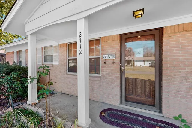 a front view of a house with a porch