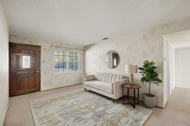 a spacious bedroom with a balcony a bed and a couch