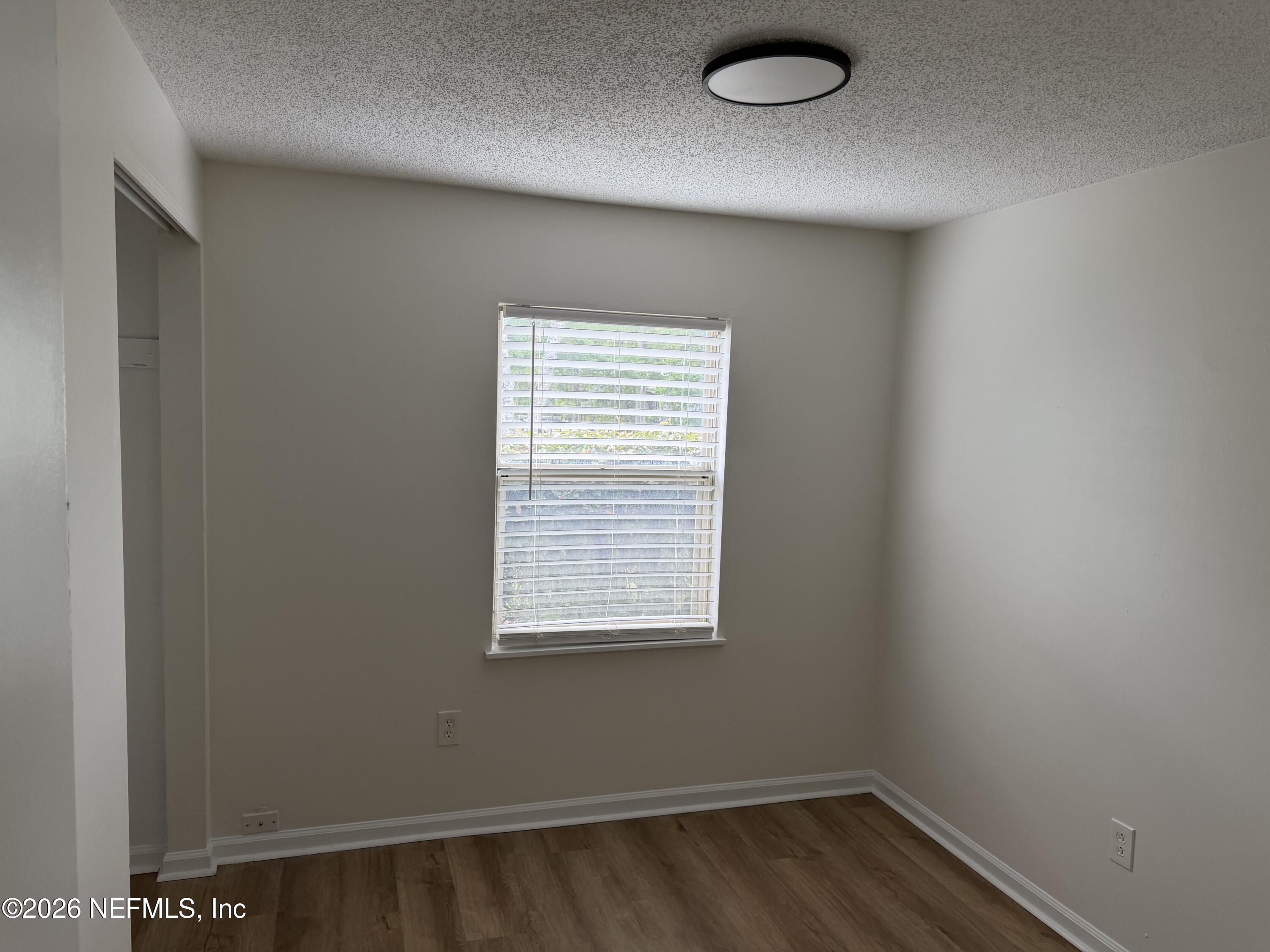 7539 Walden Road Jacksonville, FL 32244 - Photo 13 of 18 an empty room with a window