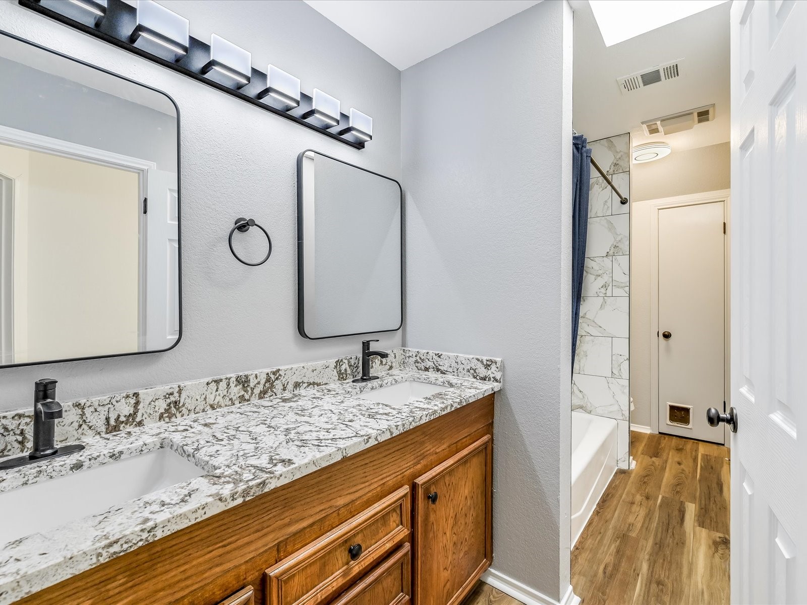 2712 Geronimo Trail Austin, TX 78734 - Photo 21 of 31 a bathroom with a granite countertop double vanity sink and mirror
