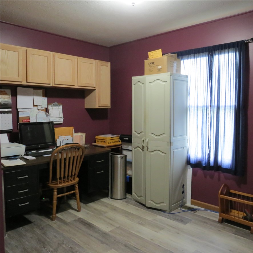 21242 Dingman-Slagle Road Pemberton, OH 45353 - Photo 14 of 33 This versatile room offers a functional workspace and ample storage.