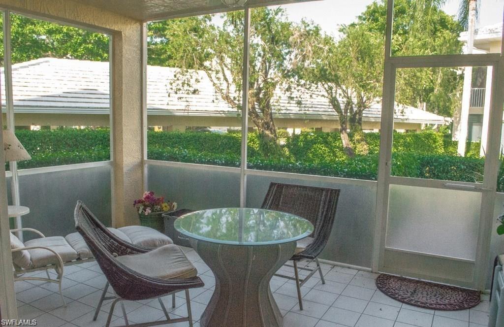 5817 Glencove Drive, Unit 404 Naples, FL 34108 - Photo 16 of 21 a view of a porch with furniture and garden