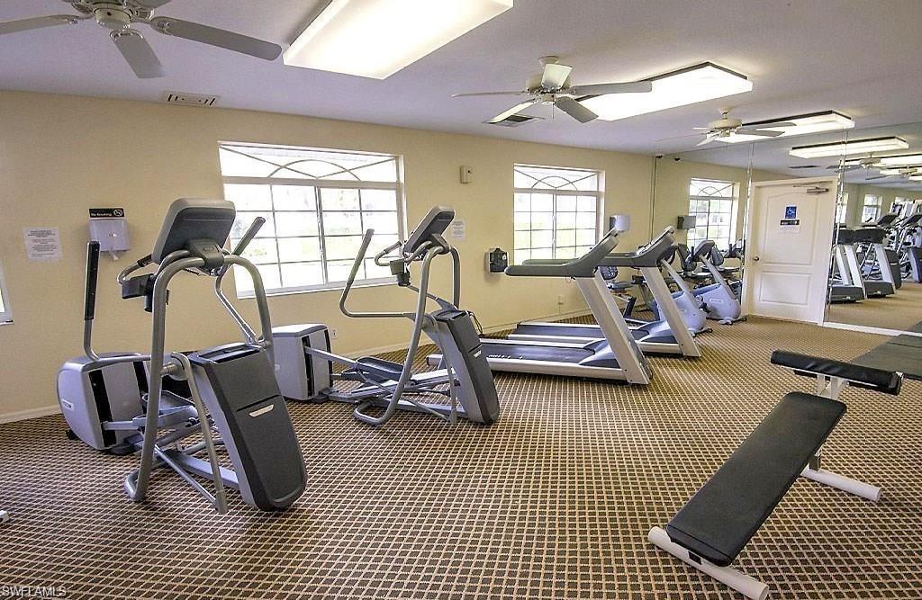 5817 Glencove Drive, Unit 404 Naples, FL 34108 - Photo 19 of 21 a view of a room with gym equipment