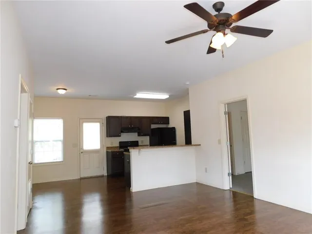 a view of a kitchen with a sink dishwasher and a kitchen view