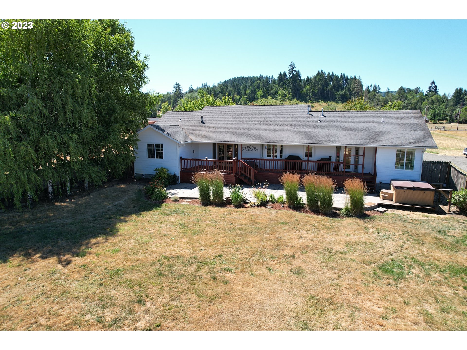 1870 Plat I Road Sutherlin, OR 97479 - Photo 42 of 47 a backyard of a house with barbeque oven table and chairs