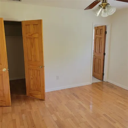 an empty room with closet area
