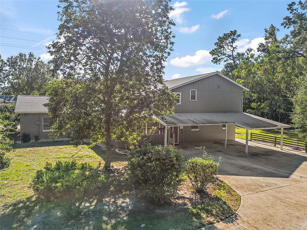 1661 Votaw Road Apopka, FL 32703 - Photo 6 of 23 a view of a house with a yard