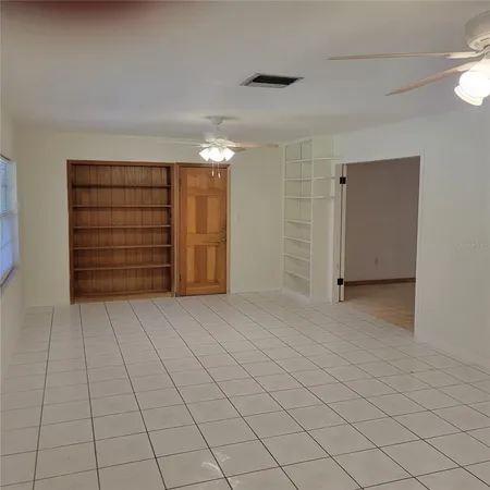 a view of an empty room and closet